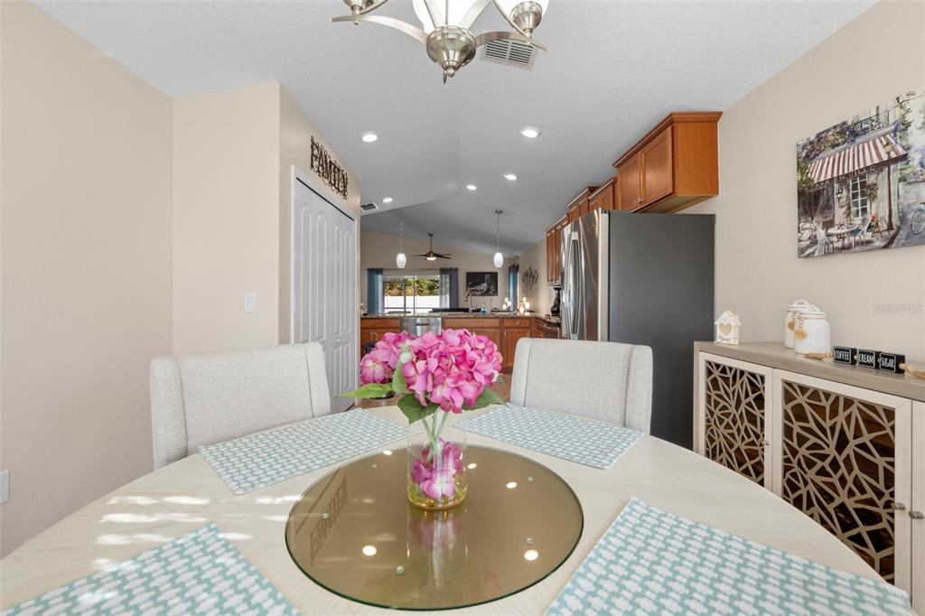 10114 Ives Loop Hudson, FL 34667 - Photo 19 of 49 a view of a dining room with furniture