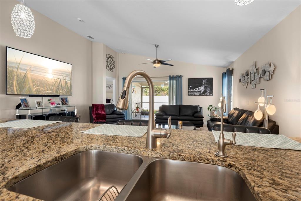 10114 Ives Loop Hudson, FL 34667 - Photo 21 of 49 a living room with furniture and a flat screen tv