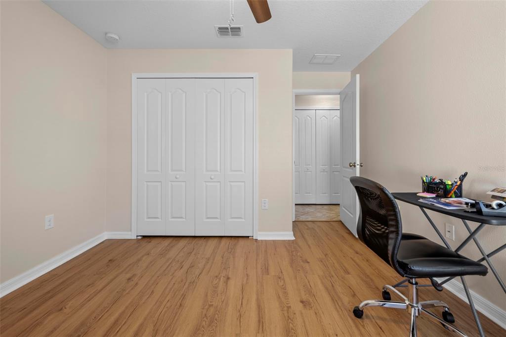 10114 Ives Loop Hudson, FL 34667 - Photo 35 of 49 a view of a room with wooden floor and lounge chair