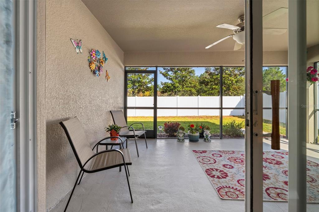 10114 Ives Loop Hudson, FL 34667 - Photo 43 of 49 workspace with wooden floor and a table