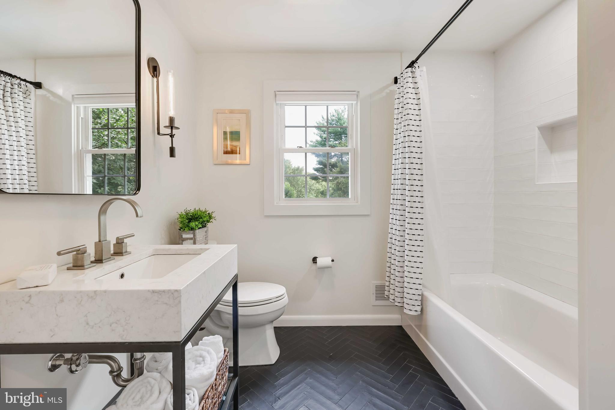 455 Schley Road Annapolis, MD 21401 - Photo 28 of 67 Herringbone tile floors and industrial vanity