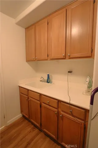 a view of cabinets and wooden floor