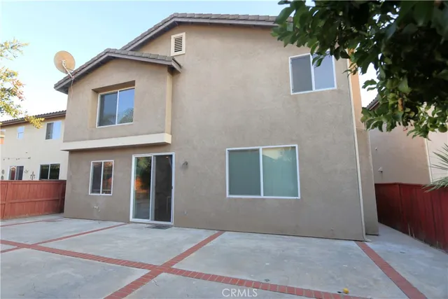 a view of backyard of a house