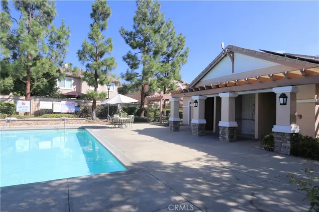 a sign board with tree in the background