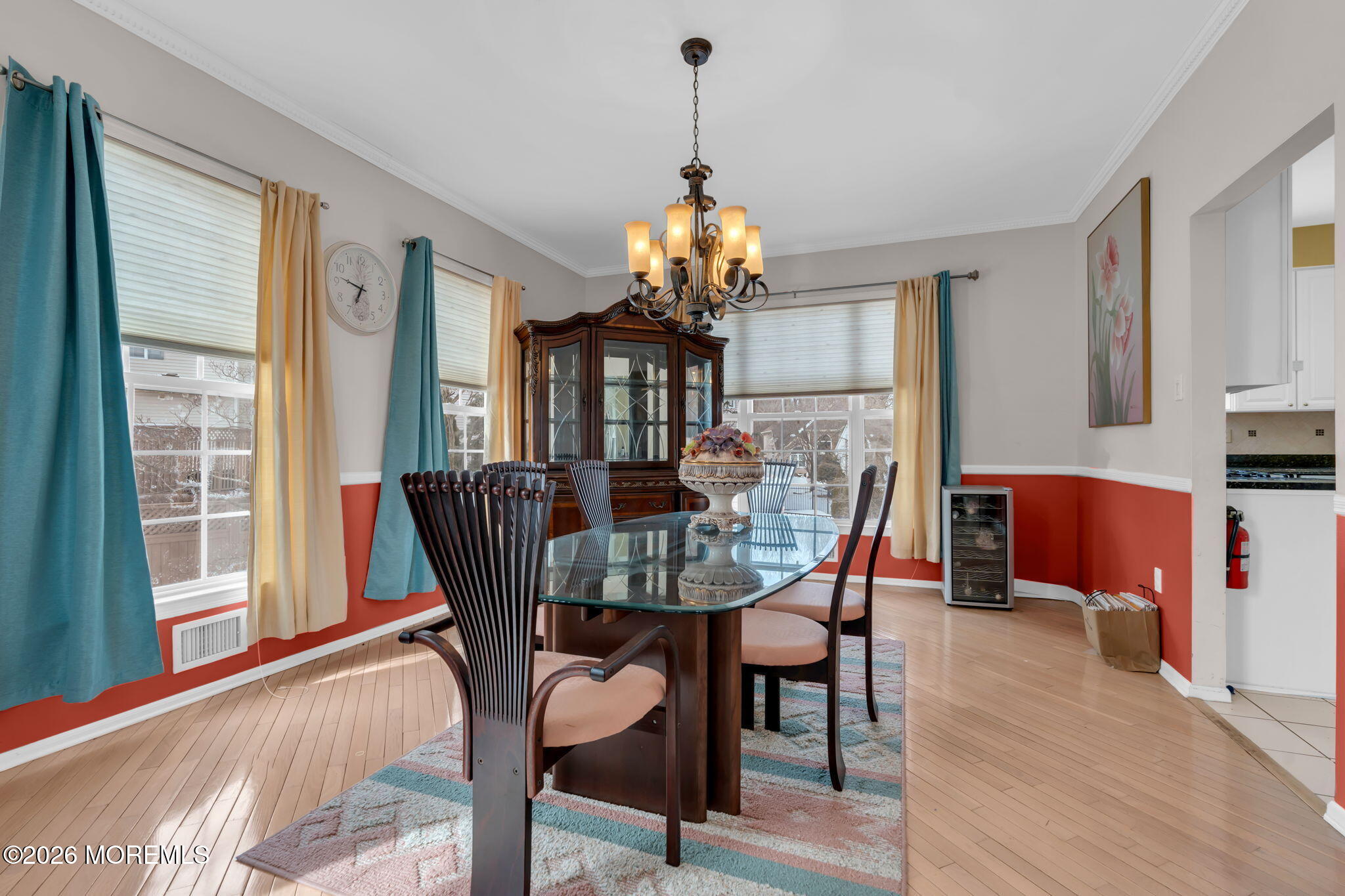 18 Lysbeth Lane Matawan, NJ 07747 - Photo 14 of 36 a dining room with furniture a chandelier and wooden floor