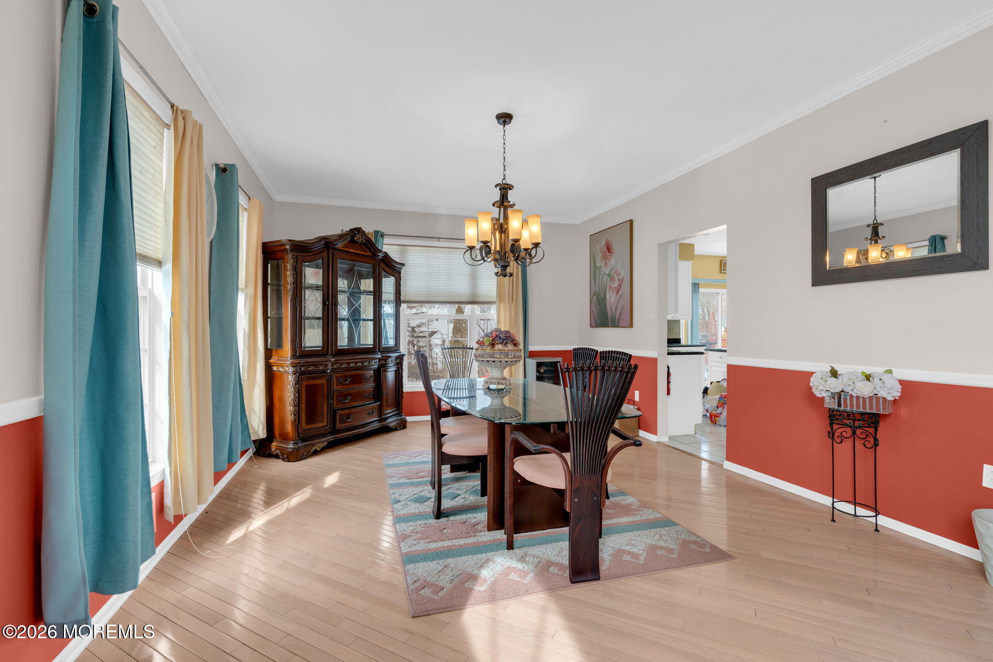 18 Lysbeth Lane Matawan, NJ 07747 - Photo 15 of 36 a dining room with furniture a chandelier and wooden floor