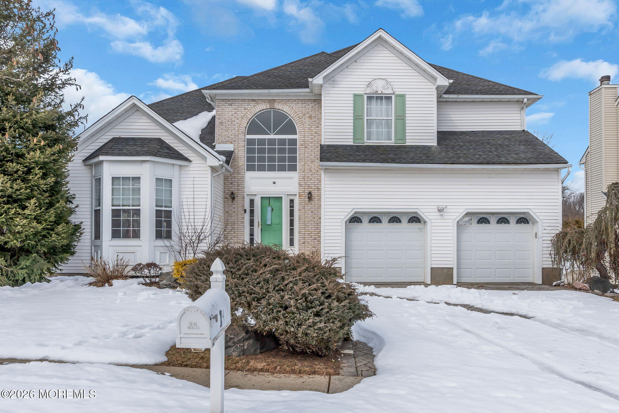 18 Lysbeth Lane Matawan, NJ 07747 - Photo 2 of 36 a front view of a house with a yard and garage