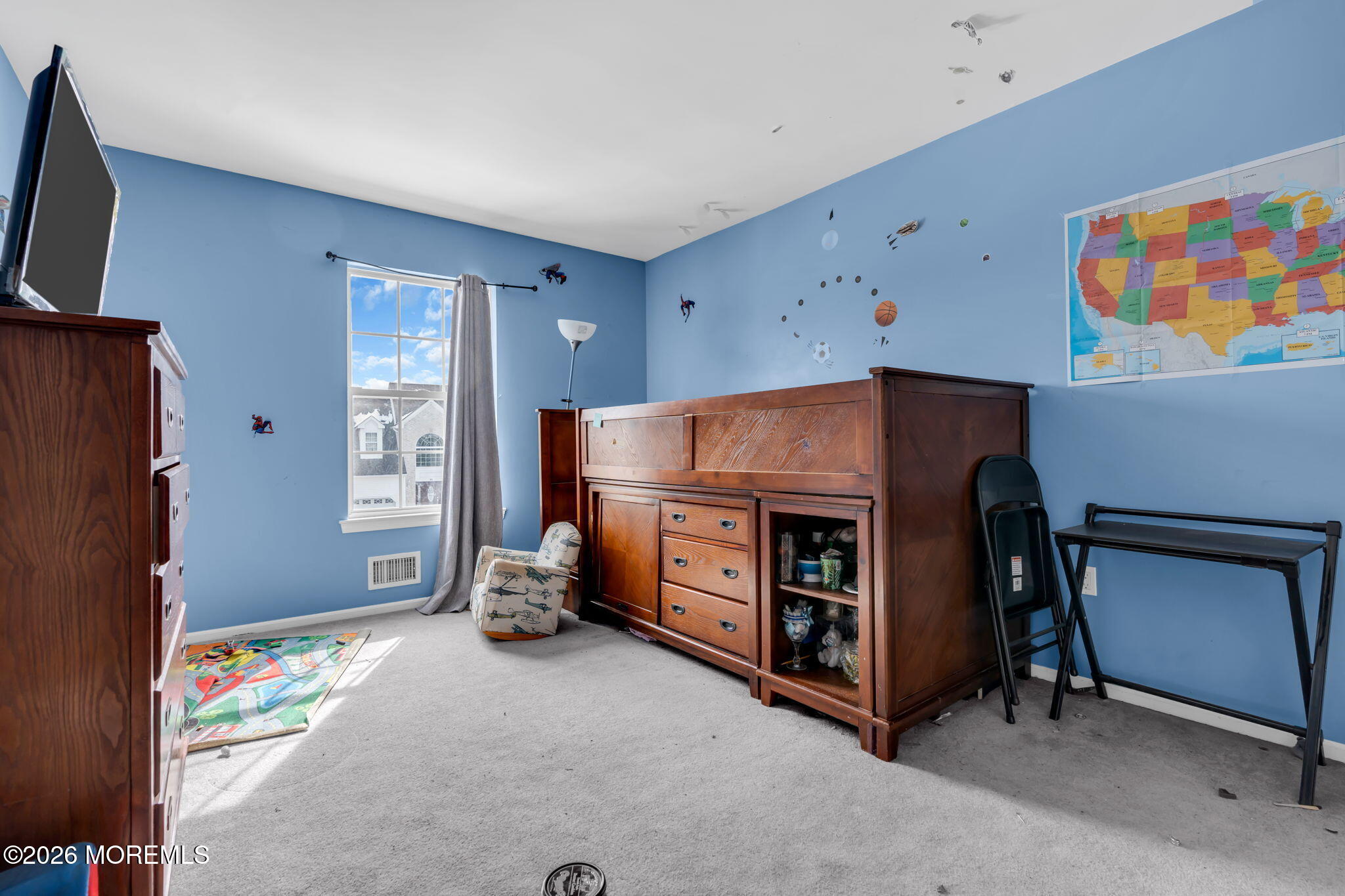 18 Lysbeth Lane Matawan, NJ 07747 - Photo 28 of 36 a room with furniture and a flat screen tv