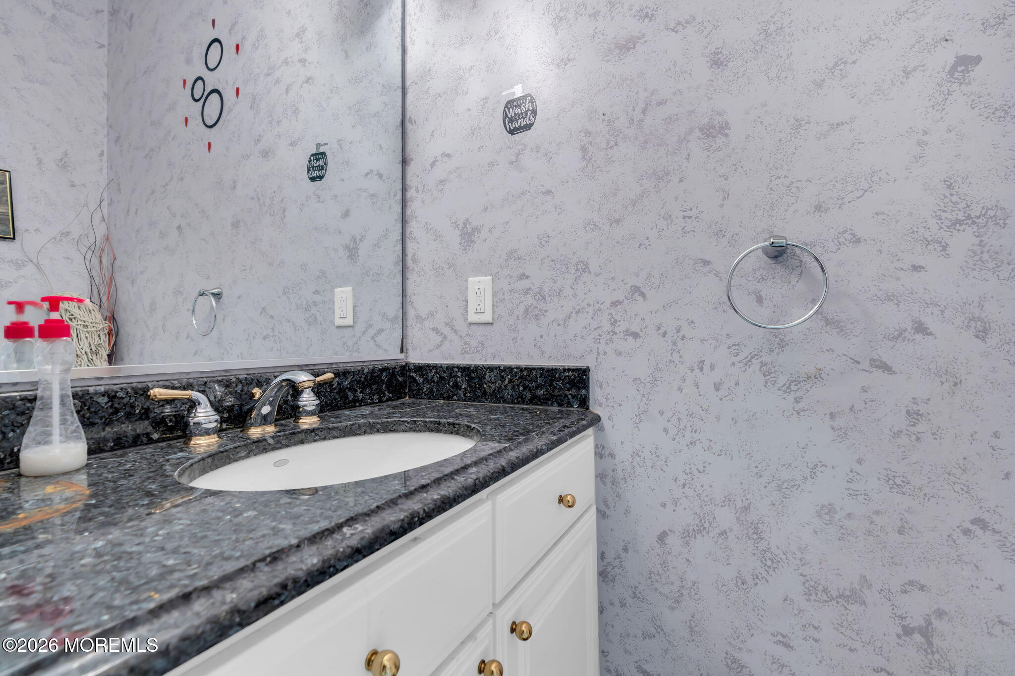 18 Lysbeth Lane Matawan, NJ 07747 - Photo 6 of 36 a bathroom with a granite countertop sink and a mirror