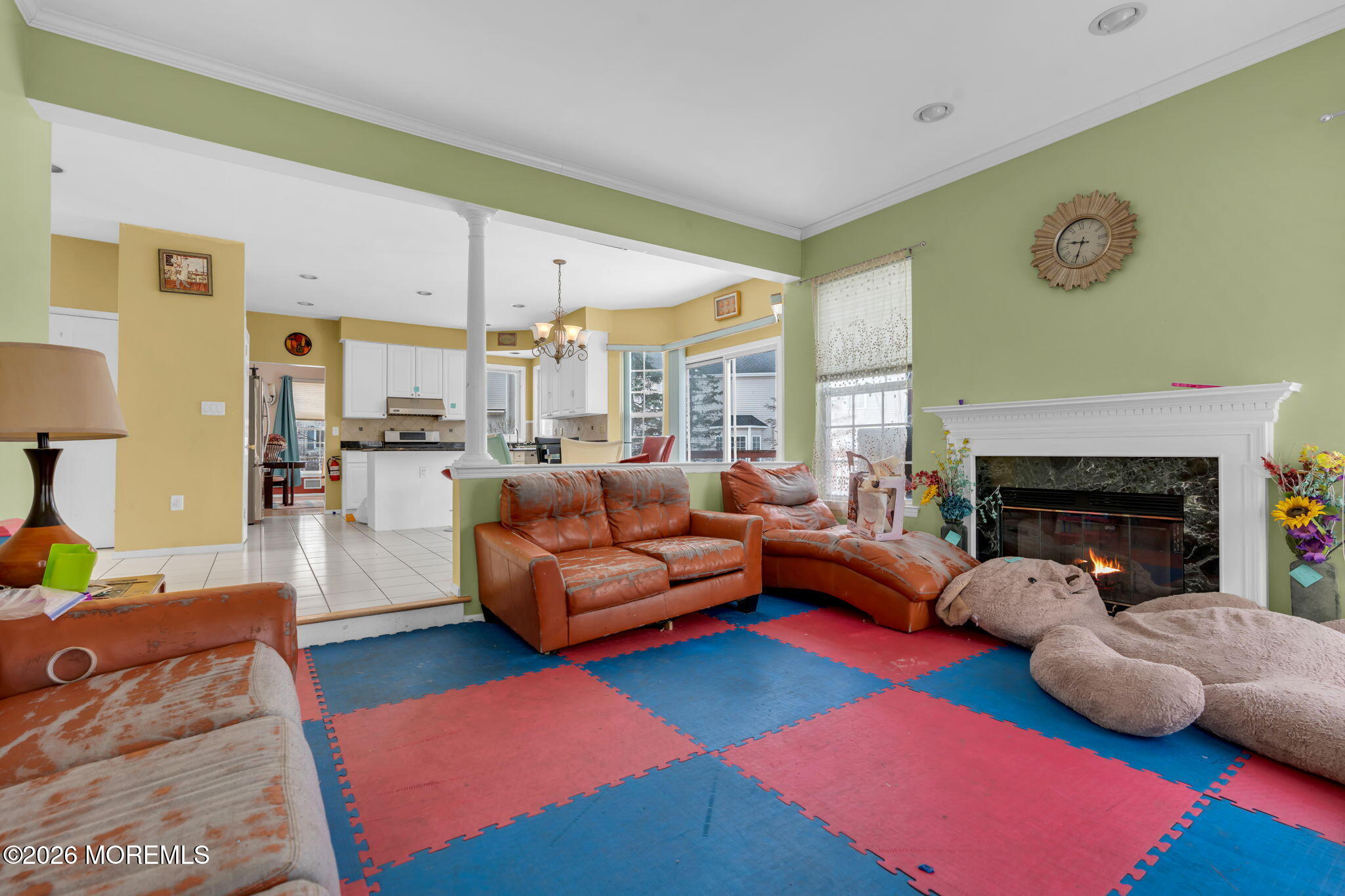 18 Lysbeth Lane Matawan, NJ 07747 - Photo 8 of 36 a living room with furniture and a fireplace