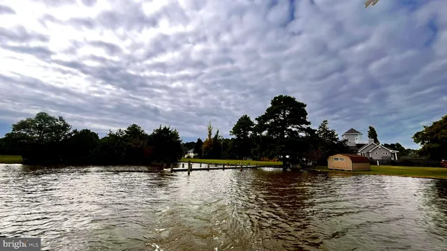 a view of a lake with outdoor seating
