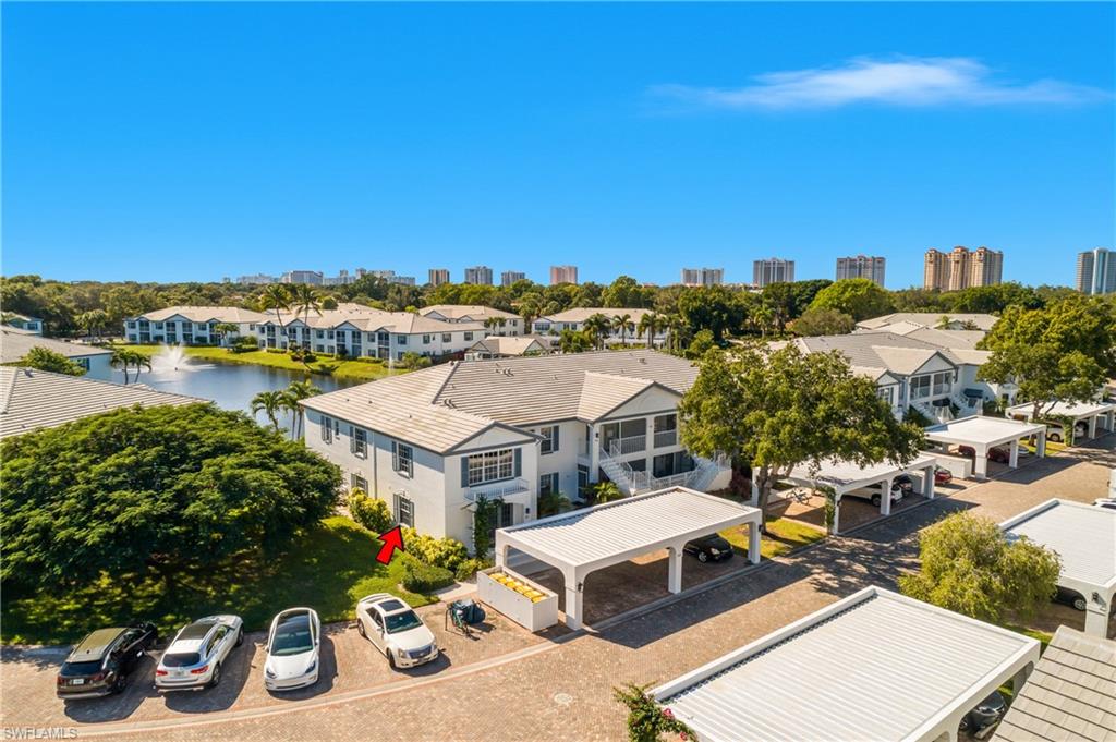 864 Tanbark Drive, Unit 101 Naples, FL 34108 - Photo 3 of 40 a view of a city from a terrace