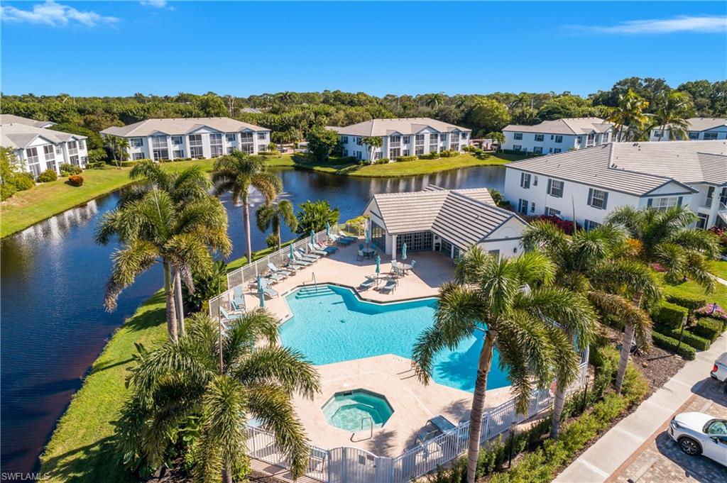 864 Tanbark Drive, Unit 101 Naples, FL 34108 - Photo 38 of 40 a view of a lake with a city