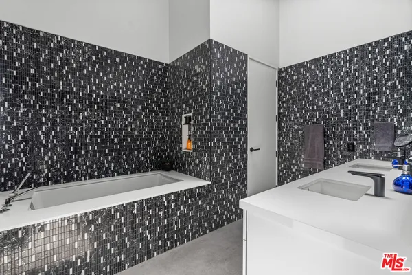 a bathroom with a bathtub and shower