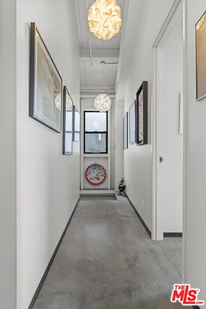 a bed room with a bed and a chair