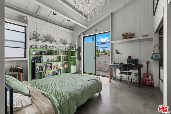 a kitchen with a table and chairs