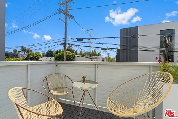 a view of balcony with furniture