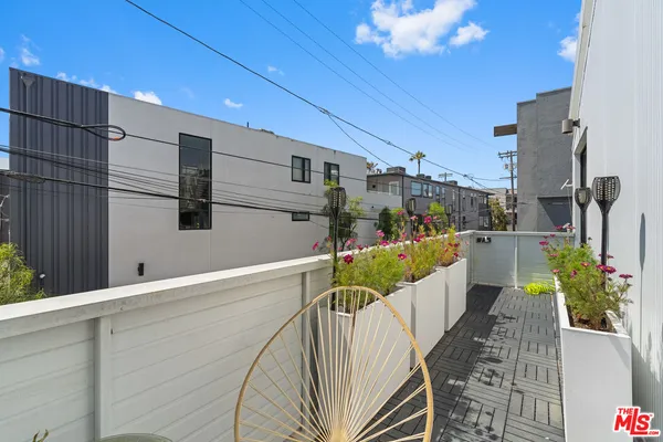 a bathroom with a double vanity sink toilet mirror and bathtub
