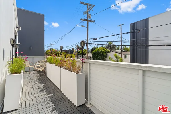 a bathroom with a sink toilet and a mirror