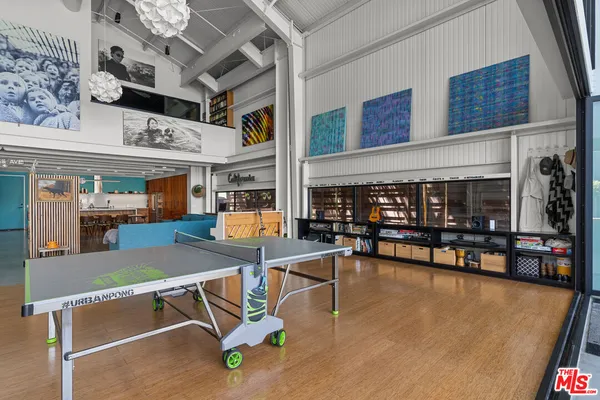 a view of a livingroom with furniture and a window