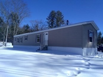 46 Madden Road, Unit 38 West Brookfield, MA 01585 - Photo 1 of 37 a view of a house with a yard