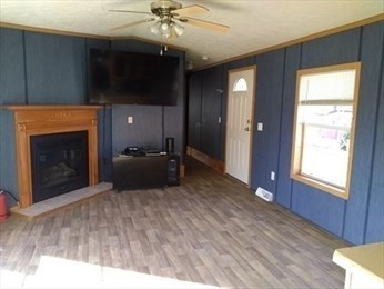 46 Madden Road, Unit 38 West Brookfield, MA 01585 - Photo 13 of 37 a living room with furniture and a fireplace