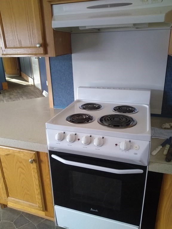 46 Madden Road, Unit 38 West Brookfield, MA 01585 - Photo 19 of 37 a stove top oven sitting inside of a kitchen