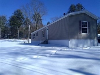 46 Madden Road, Unit 38 West Brookfield, MA 01585 - Photo 2 of 37 a view of back yard of the house