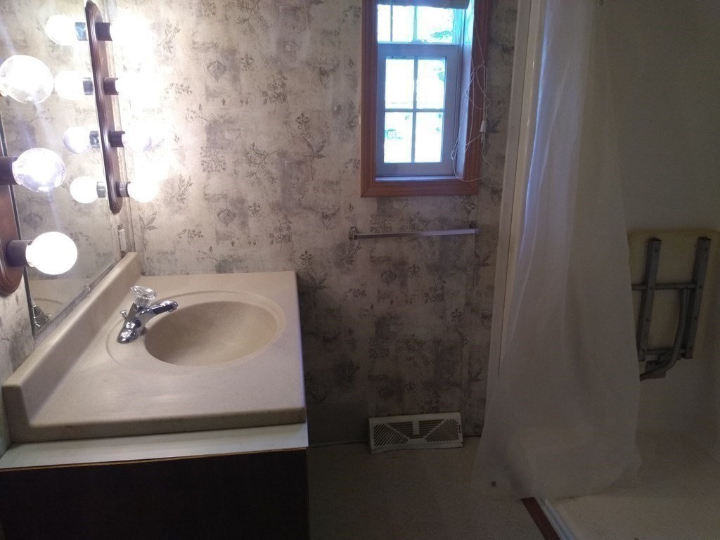 46 Madden Road, Unit 38 West Brookfield, MA 01585 - Photo 25 of 37 a bathroom with a sink and a mirror