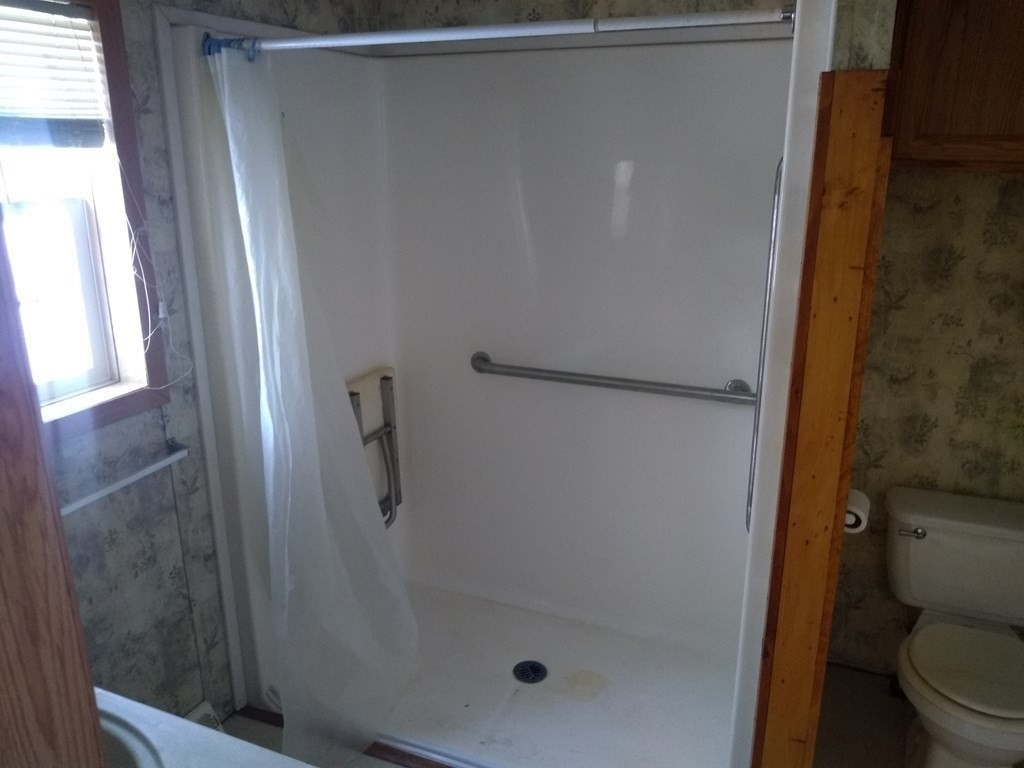 46 Madden Road, Unit 38 West Brookfield, MA 01585 - Photo 26 of 37 a bathroom with a shower and toilet