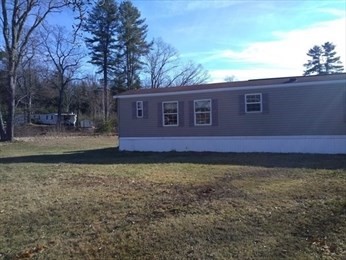 46 Madden Road, Unit 38 West Brookfield, MA 01585 - Photo 5 of 37 a view of a house with a yard