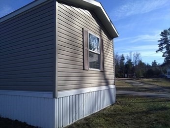 46 Madden Road, Unit 38 West Brookfield, MA 01585 - Photo 6 of 37 a view of a house with a yard