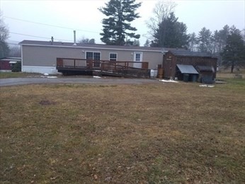 46 Madden Road, Unit 38 West Brookfield, MA 01585 - Photo 9 of 37 a view of a house with backyard and deck