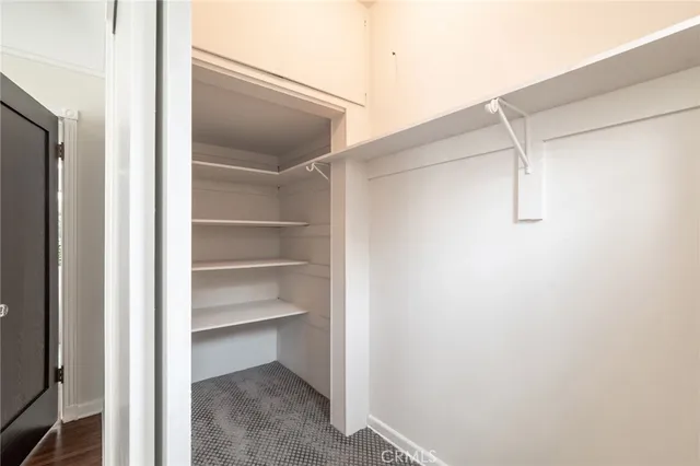 a view of an empty walk in closet