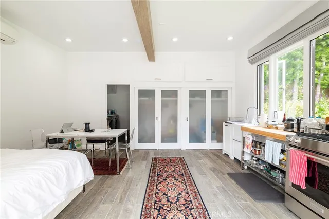 a bed room with bed and a window