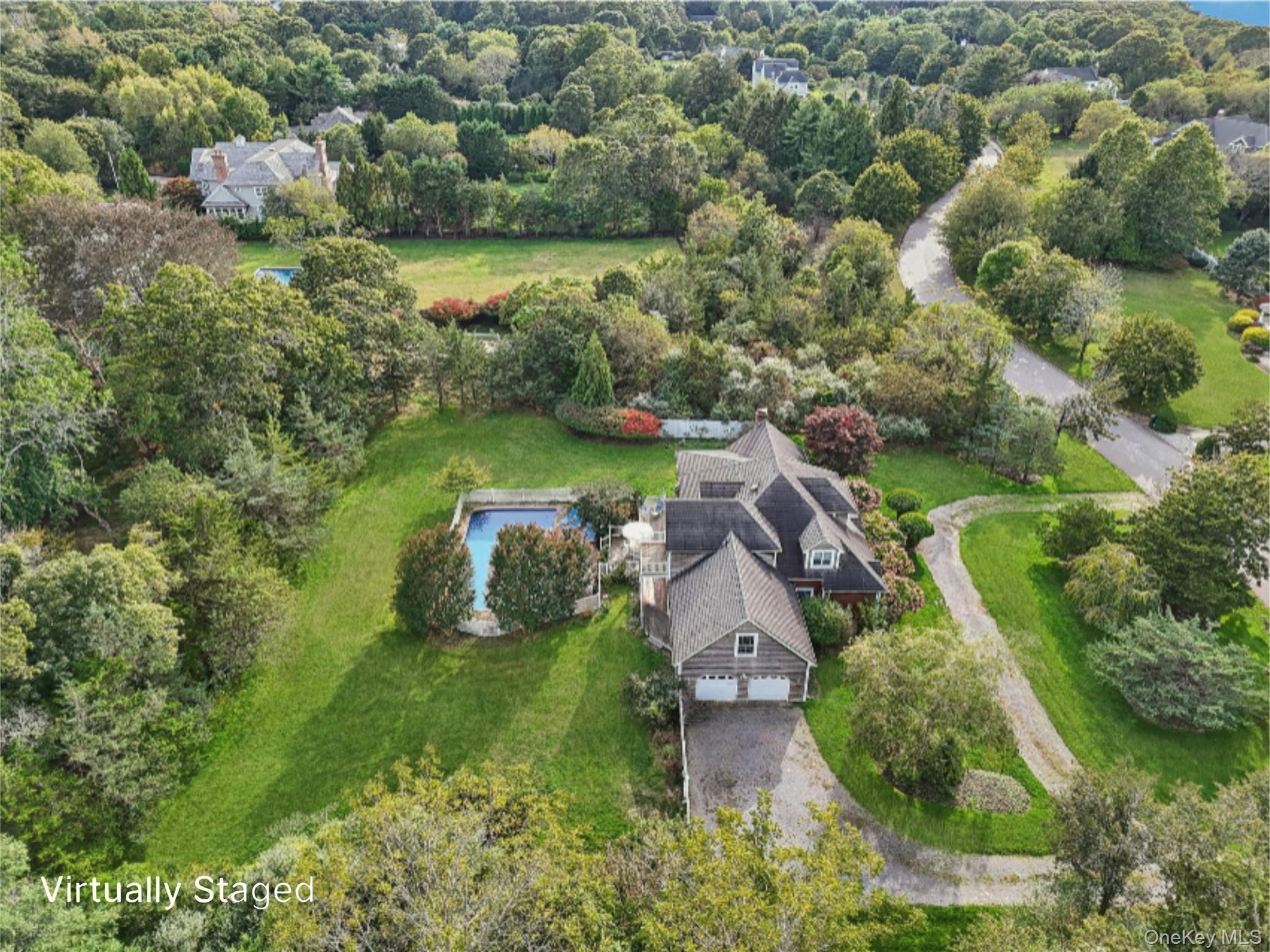 12 Laila Lane Remsenburg, NY 11960 - Photo 46 of 50 an aerial view of a houses with outdoor space and trees all around