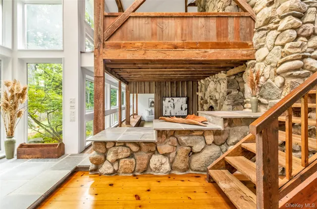 a view of a swimming pool with a patio and a yard