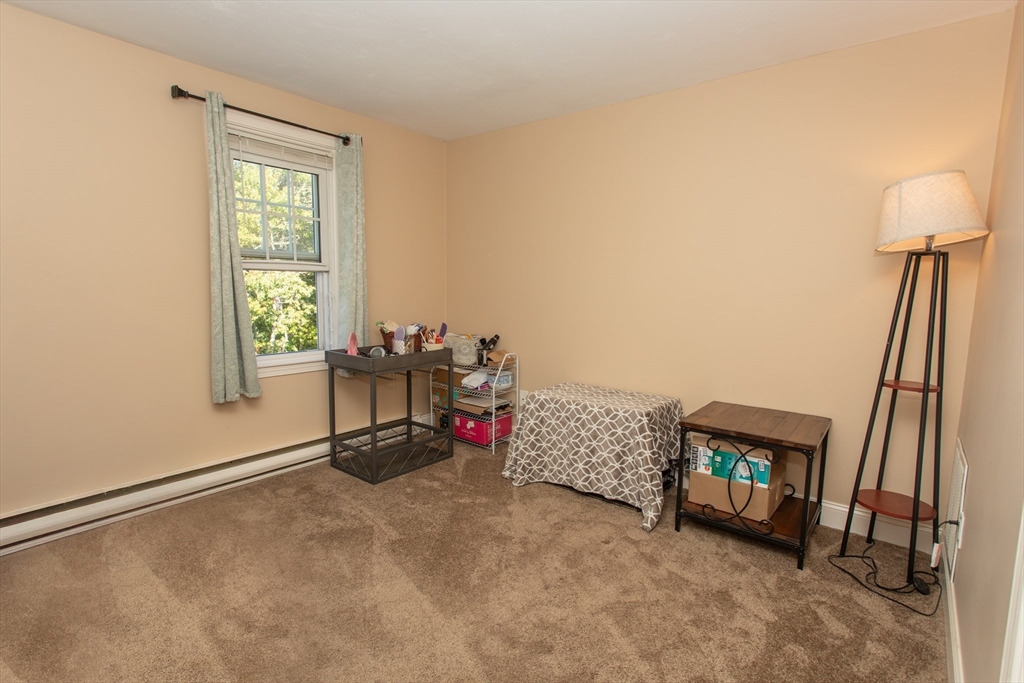 11 Village Green Road, Unit B Bourne, MA 02562 - Photo 16 of 23 a room with furniture and a window
