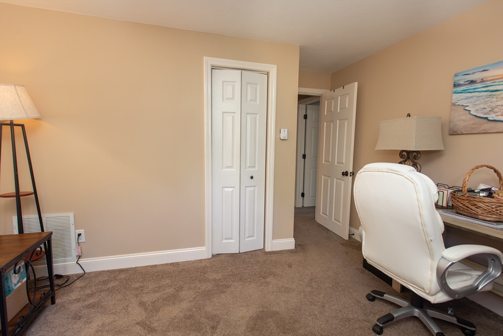 11 Village Green Road, Unit B Bourne, MA 02562 - Photo 17 of 23 a view of a workspace with furniture and a window