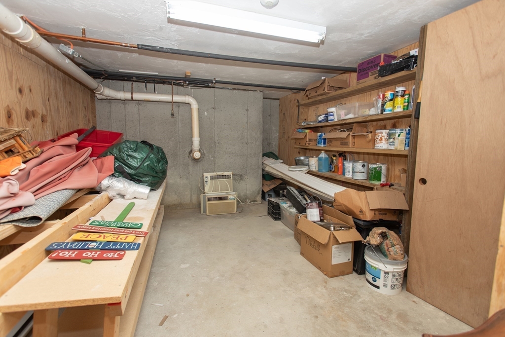 11 Village Green Road, Unit B Bourne, MA 02562 - Photo 18 of 23 a view of walk in closet with clothes and shoes