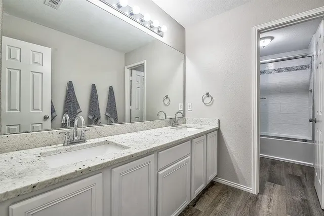 a bedroom with a bed and a cabinets