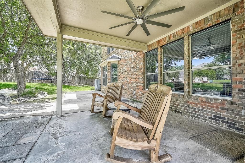 1109 Brandy Court Midlothian, TX 76065 - Photo 20 of 26 Fenced backyard with a patio and a ceiling fan