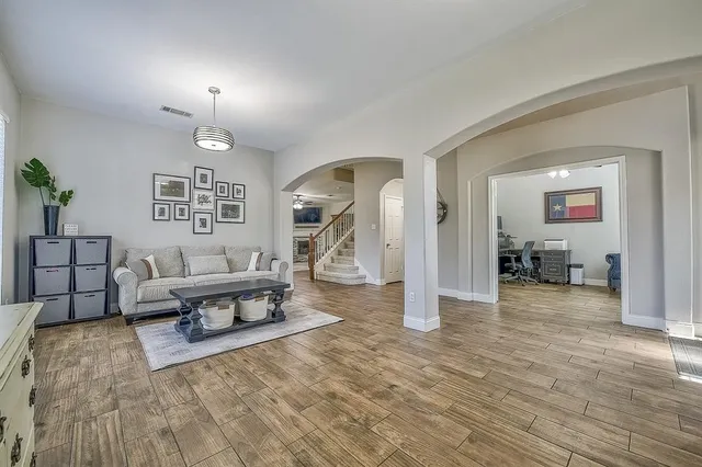 a living room with furniture and windows