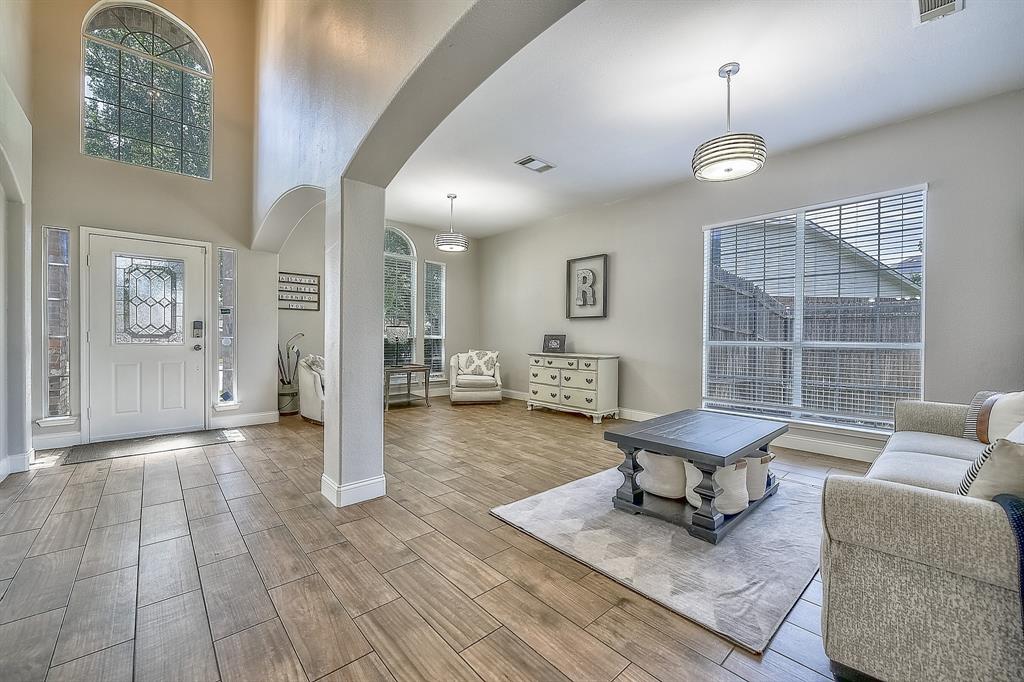 1109 Brandy Court Midlothian, TX 76065 - Photo 5 of 26 Entryway featuring arched walkways and wood finish floors