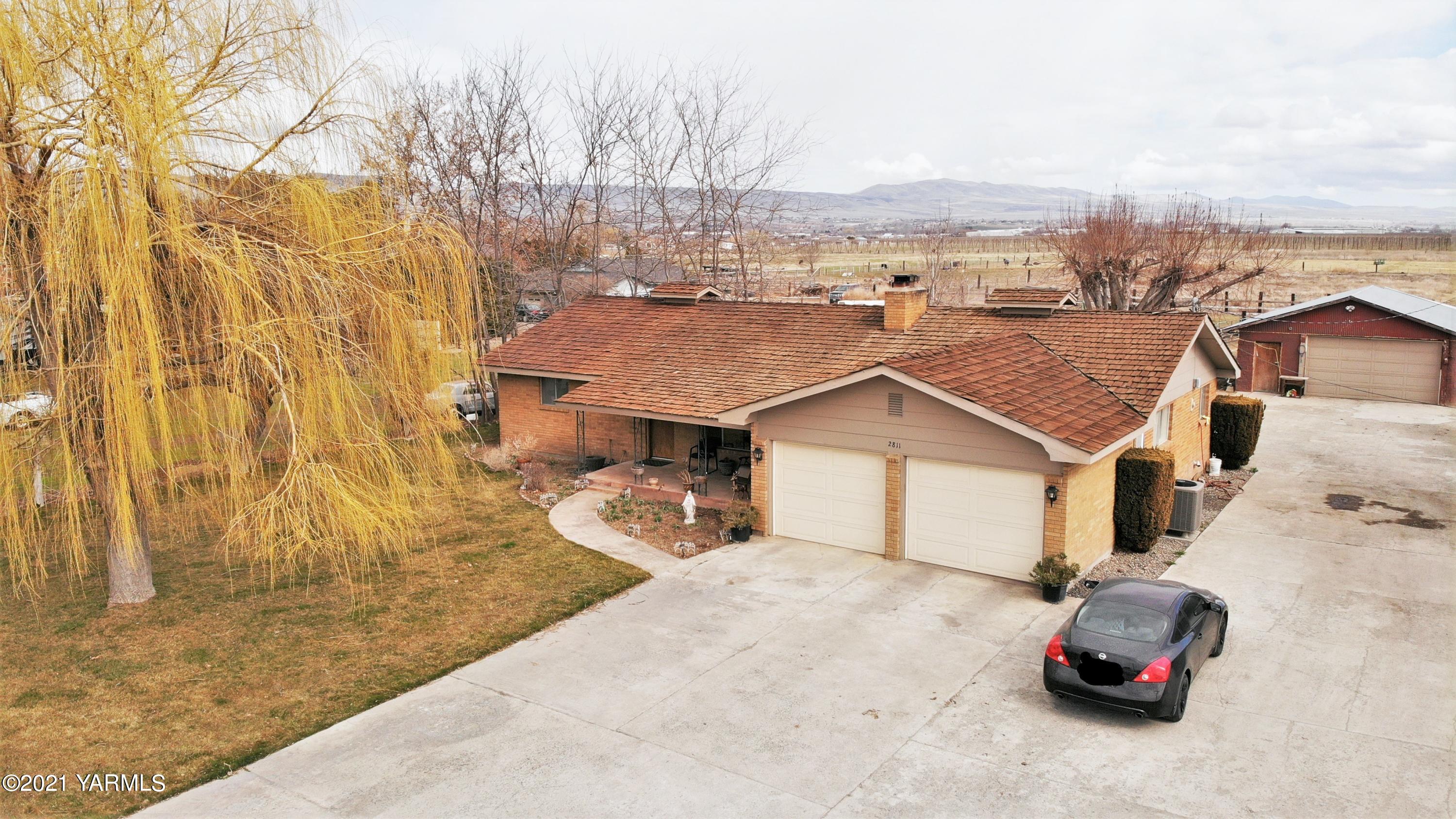 2811 Birchfield Road Yakima, WA 98901 - Photo 1 of 24 aerial view of a house with a patio