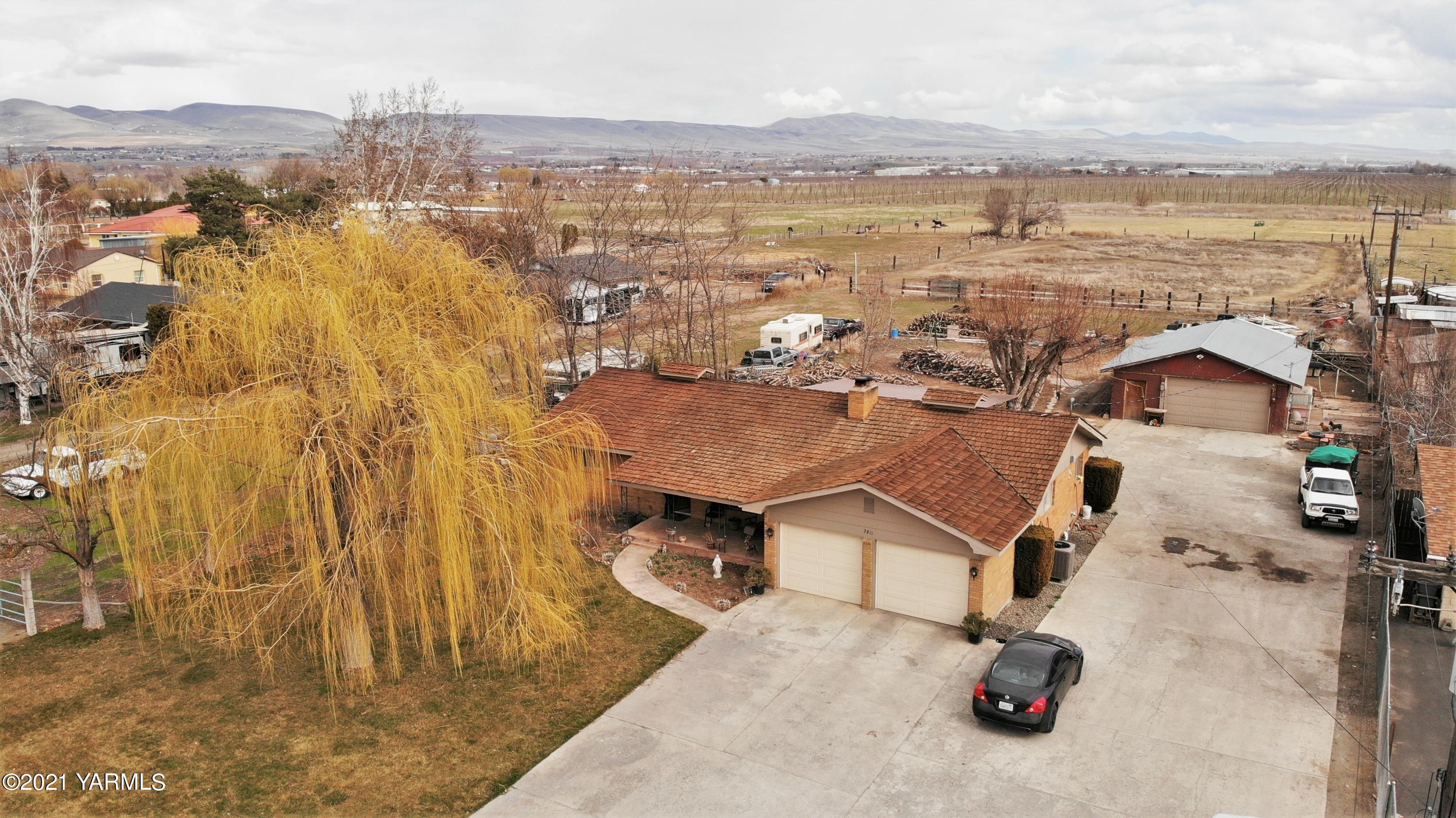 2811 Birchfield Road Yakima, WA 98901 - Photo 2 of 24 an aerial view of residential houses with outdoor space