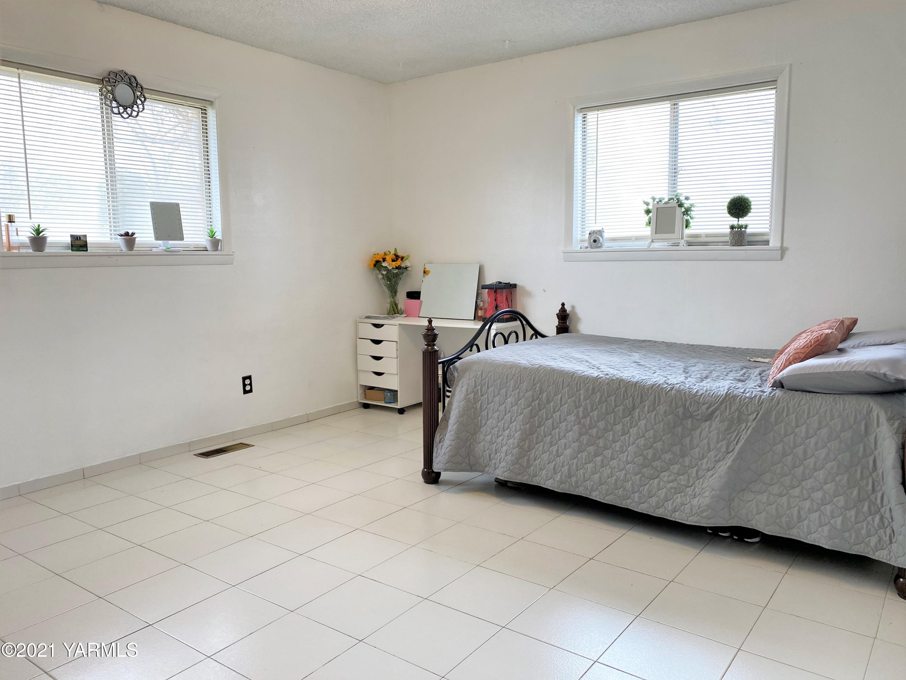 2811 Birchfield Road Yakima, WA 98901 - Photo 9 of 24 a bedroom with a bed and window