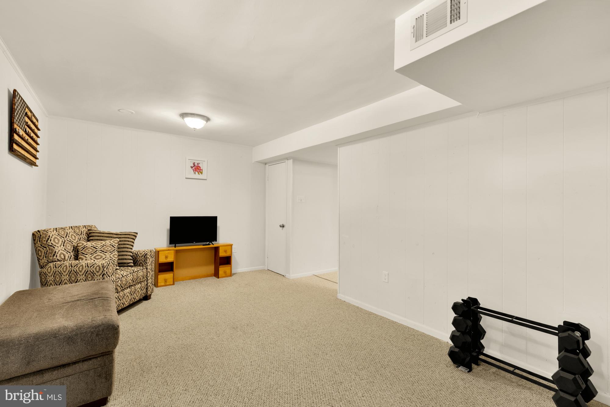 8100 Loving Forest Court Springfield, VA 22153 - Photo 26 of 33 a living room with furniture and a flat screen tv