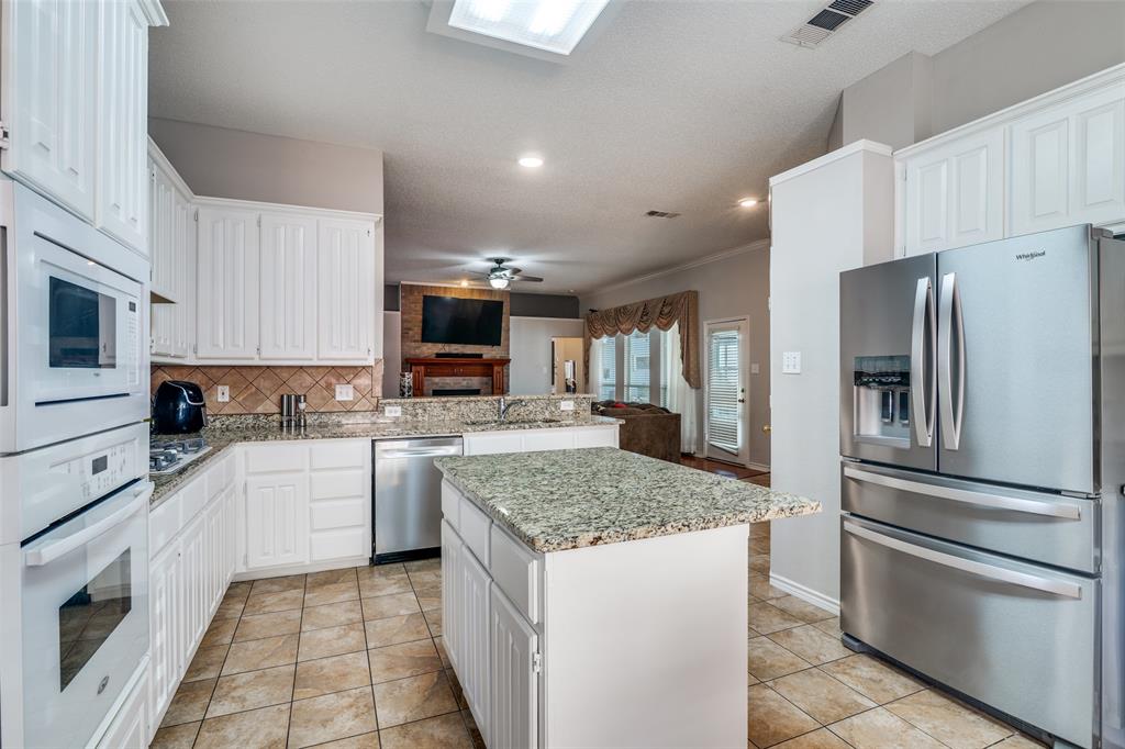 3214 Chalkstone Drive Rowlett, TX 75088 - Photo 16 of 36 Kitchen over looks to family room for ease of entertaining.
