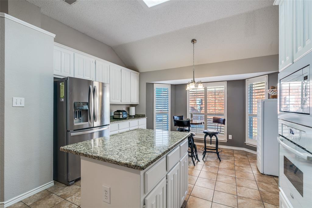 3214 Chalkstone Drive Rowlett, TX 75088 - Photo 17 of 36 Breakfast area has bay window, and butler pantry.